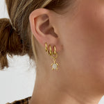 Earrings with a dangling turtle