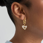 Squoval earrings with dangling mother-of-pearl hearts