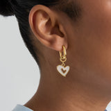 Squoval earrings with dangling mother-of-pearl hearts