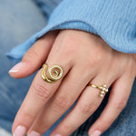Spiral shell statement ring with stones