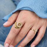 Spiral shell statement ring with stones