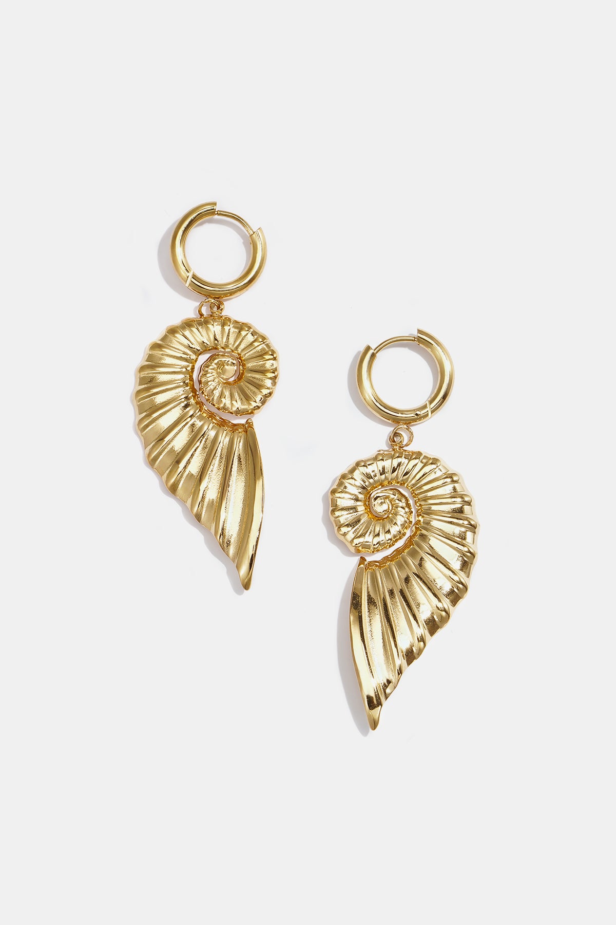 Small hoop earrings with large twist shell charm