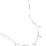 Necklace with alternating hearts and dangling stones