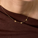 Necklace with beads and hearts with stone