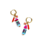 Earrings with dangling beads and a floral print