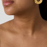 Statement earrings in a donut shape