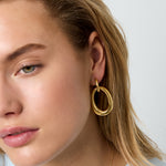 Statement earrings with detailed oval pendant