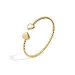 Symmetrically dotted bangle with detailed ends
