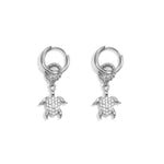 Earrings with a dangling turtle