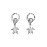 Earrings with a dangling turtle