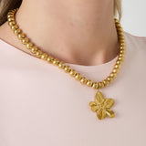 8mm hollow bead necklace with a flower