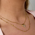Necklace with cross and star charms