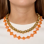 Bead necklace with clover beads