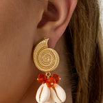 Earrings with shell-shaped pendants and beads