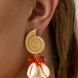 Earrings with shell-shaped pendants and beads