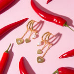 Triple earrings with heart pendants and pearl