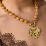 Bead necklace with front closure charm