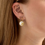 Earrings with starfish in circle