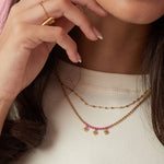 Layered necklaces with beads and hearts