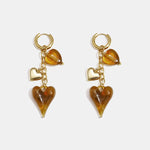 Earrings with dangling hearts on a chain