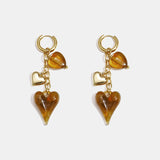 Earrings with dangling hearts on a chain