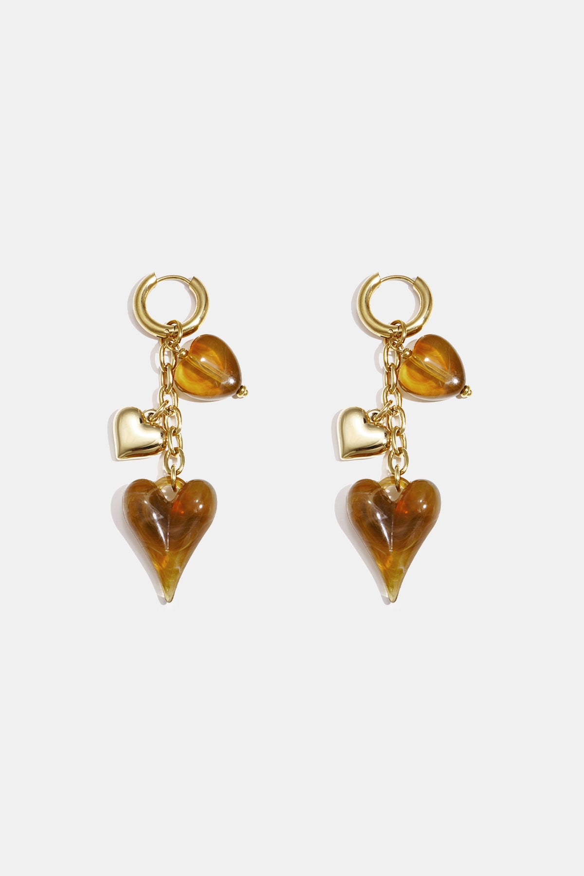 Earrings with dangling hearts on a chain