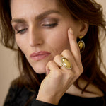 Oval statement ring surrounded by stones