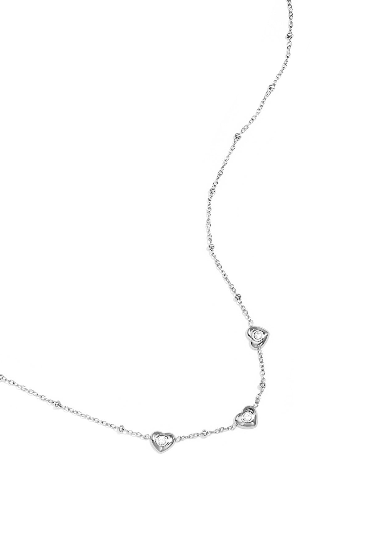 Necklace with beads and hearts with stone