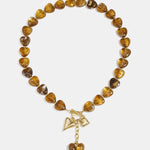 Bead necklace with hanging heart charms