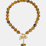 Bead necklace with hanging heart charms