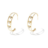 Double hoop earrings with hearts and cubic zirconia stones