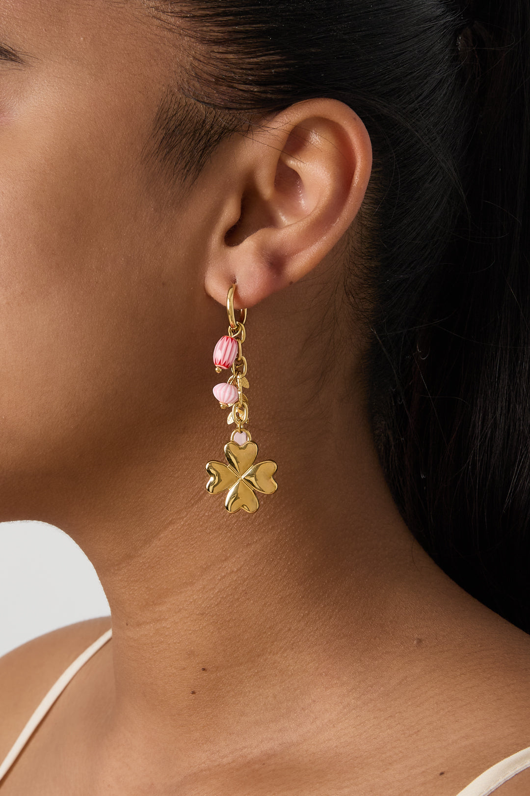 Small hoop earrings with hanging clover, beads and leaves