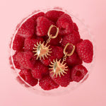 Earrings with dangling hearts and sunbeams
