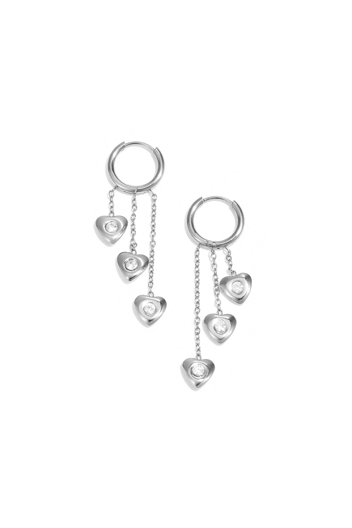 Earrings with dangling hearts at different heights