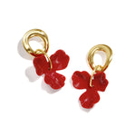 Round earrings with hanging flower