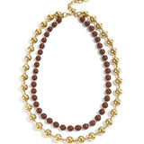 Linked necklace with gold and colored beads