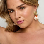 Earrings with shell-shaped pendants and beads