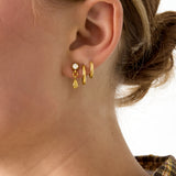 Stud earrings with dangling drop