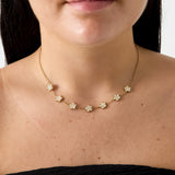 Elegant necklace with zirconia-set flowers