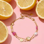 Charm bracelets with stones, beads, and coin