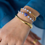 Solid beaded bracelet with beads in a blue floral print