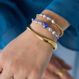 Solid beaded bracelet with beads in a blue floral print