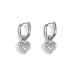 Squoval earrings with heart charms with set edges