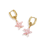 Earrings with spotted starfish
