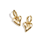 Hoop earrings with hanging heart and pearls