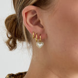 Earrings with dangling mother-of-pearl hearts