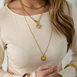 Necklace with flat details and large pendant