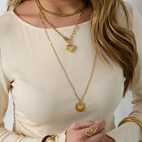 Necklace with flat details and large pendant