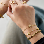 Bracelet with three solid hearts and stones