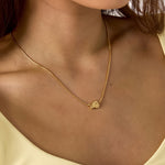 Minimalist necklace with small spiral shell